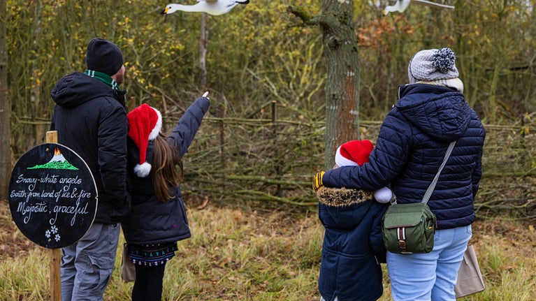 A family on the Winter Woodland Walk at Wicken Fen, Cambridgeshire